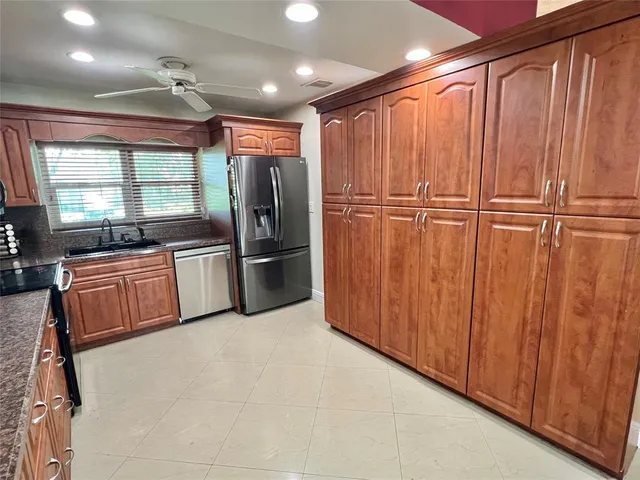 a view of a refrigerator in kitchen and wooden floor