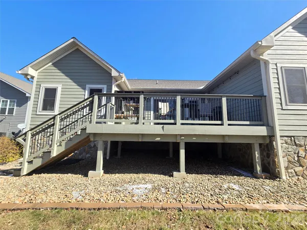 a view of a deck with wooden floor and furniture