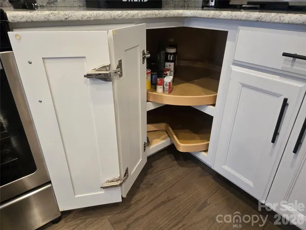 a shelf with cup and plates