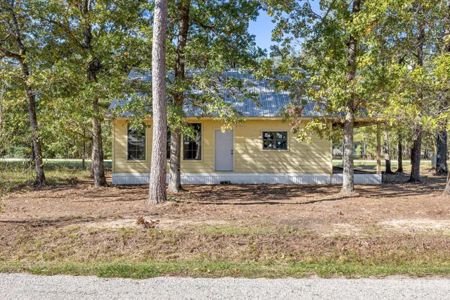 a backyard of a house with lots of green space