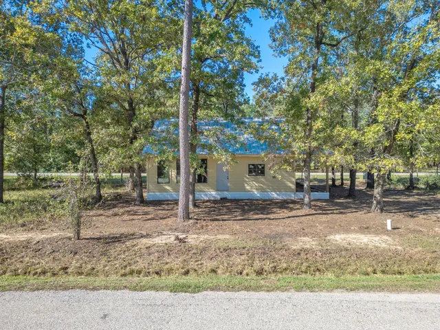 a backyard of a house with lots of green space
