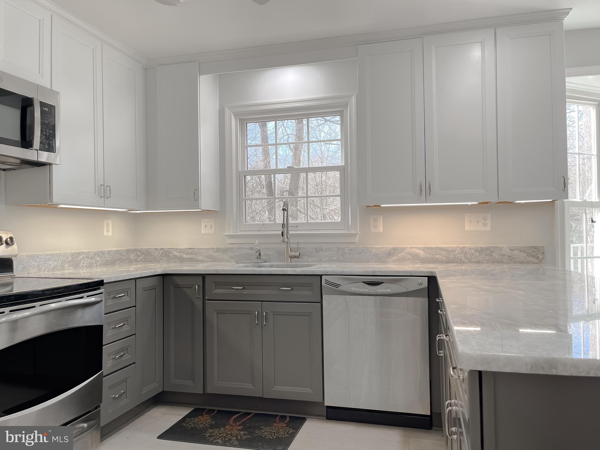 513 Clarks Run Road La Plata, MD 20646 - Photo 12 of 45 a kitchen with a sink stove and microwave