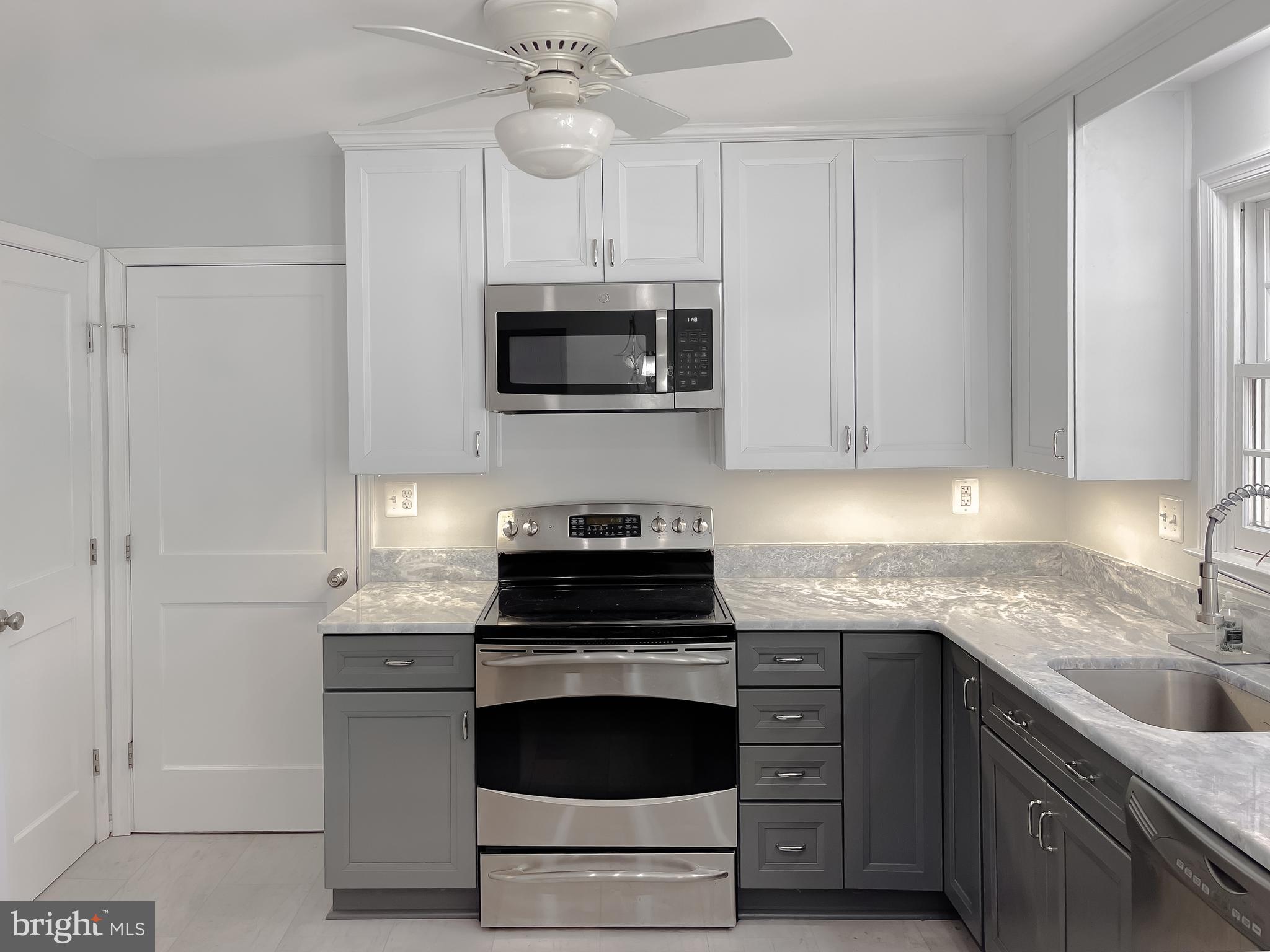 513 Clarks Run Road La Plata, MD 20646 - Photo 13 of 45 a kitchen with granite countertop white cabinets and stainless steel appliances