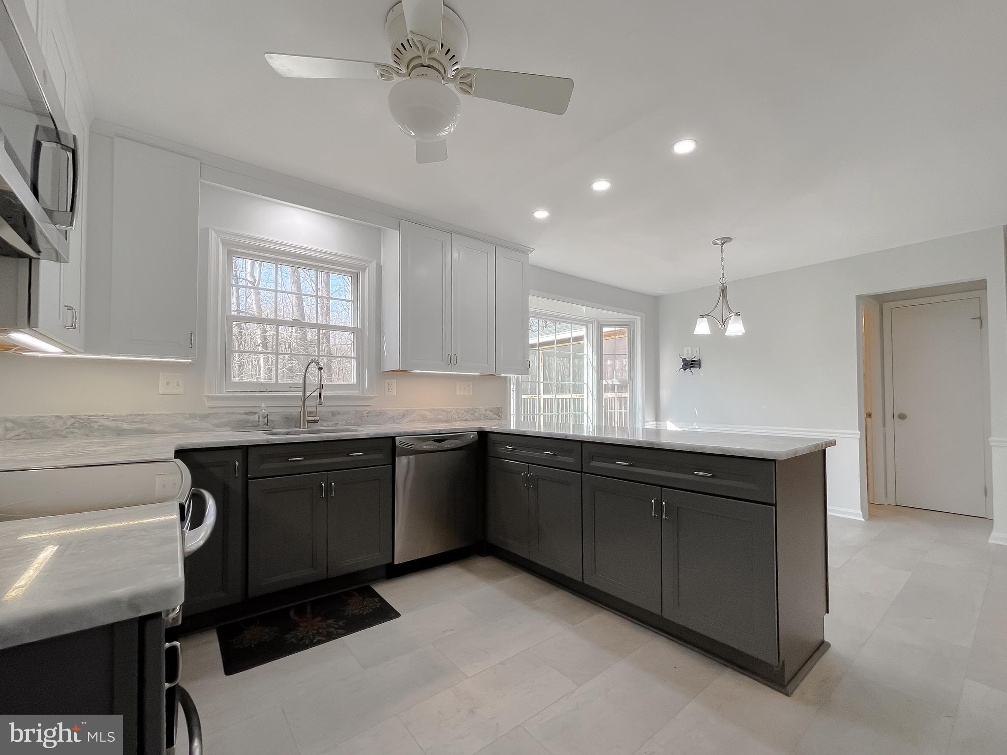 513 Clarks Run Road La Plata, MD 20646 - Photo 14 of 45 a kitchen with granite countertop cabinets a sink and a stove