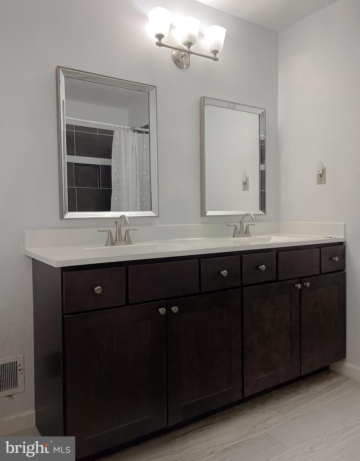 513 Clarks Run Road La Plata, MD 20646 - Photo 23 of 45 a bathroom with a double vanity sink and a mirror