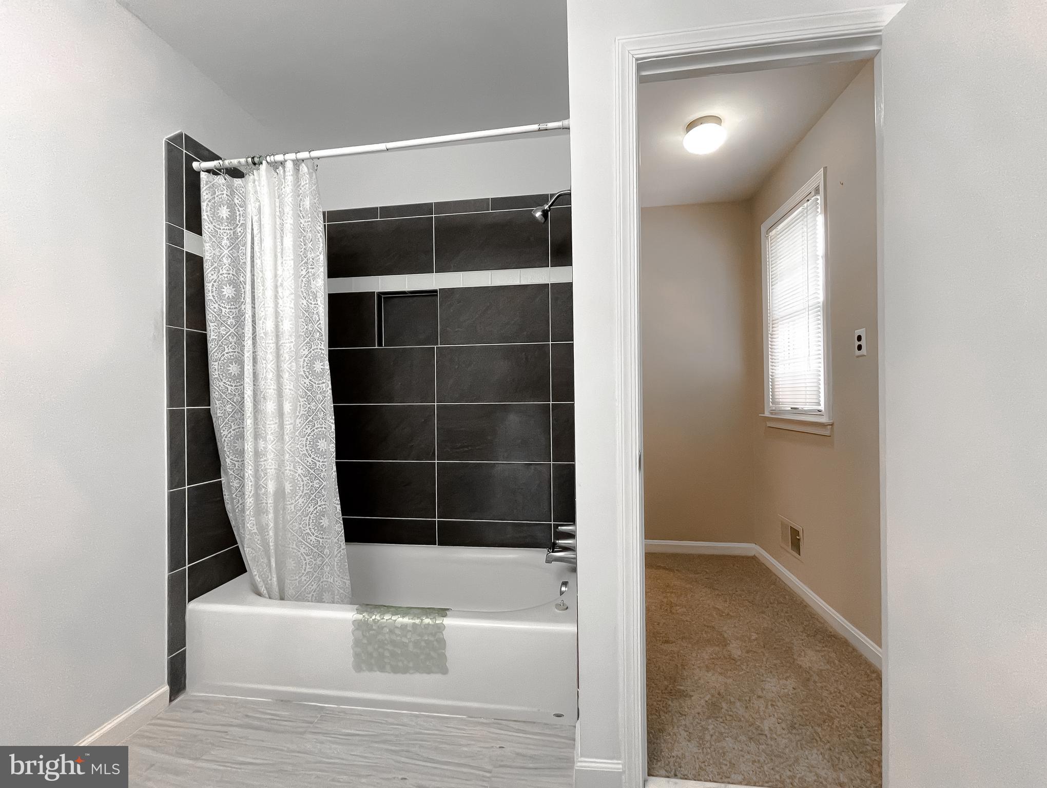 513 Clarks Run Road La Plata, MD 20646 - Photo 24 of 45 a bathroom with a bathtub and a window