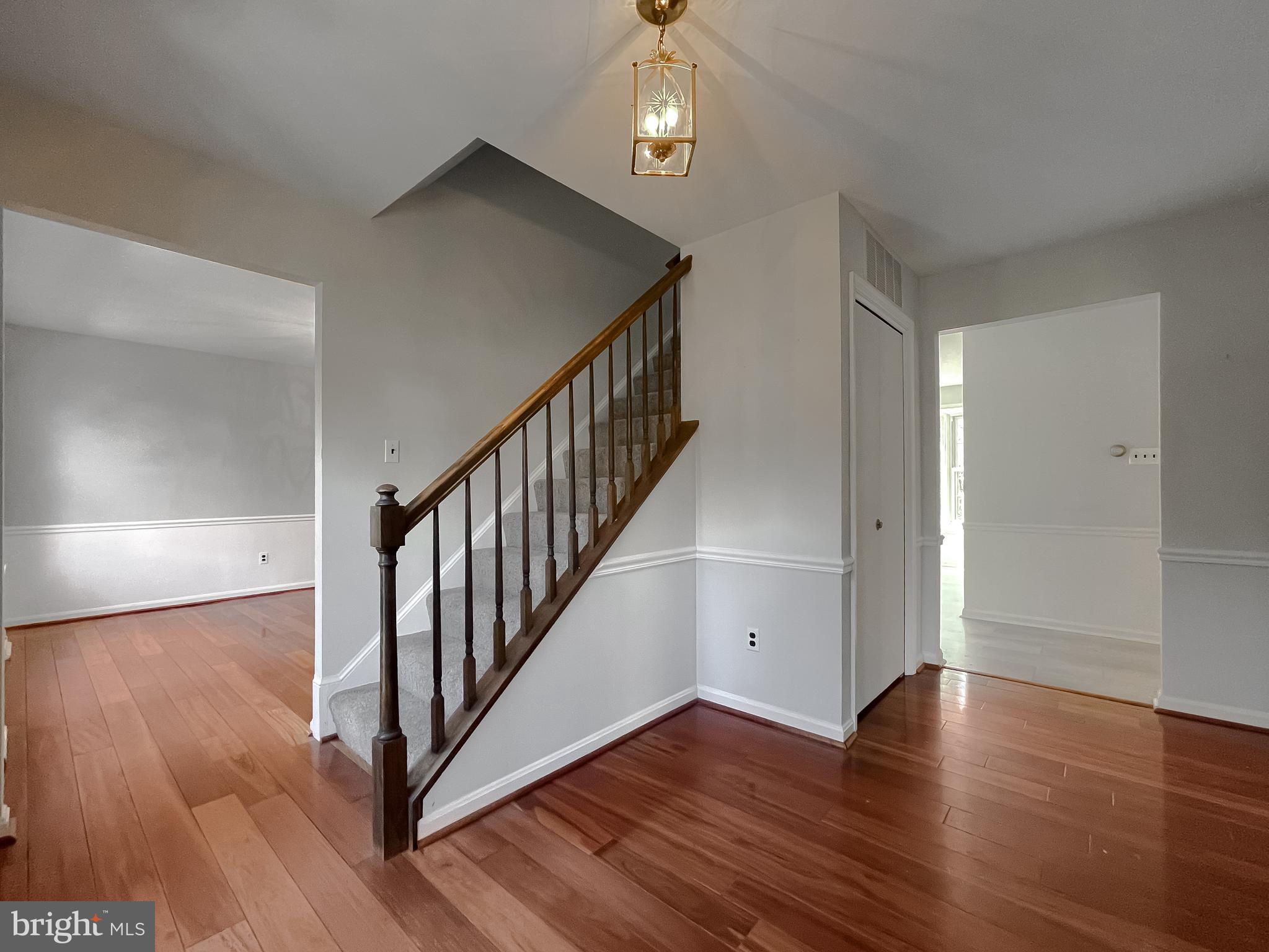 513 Clarks Run Road La Plata, MD 20646 - Photo 3 of 45 a view of a hallway with wooden floor and stairs