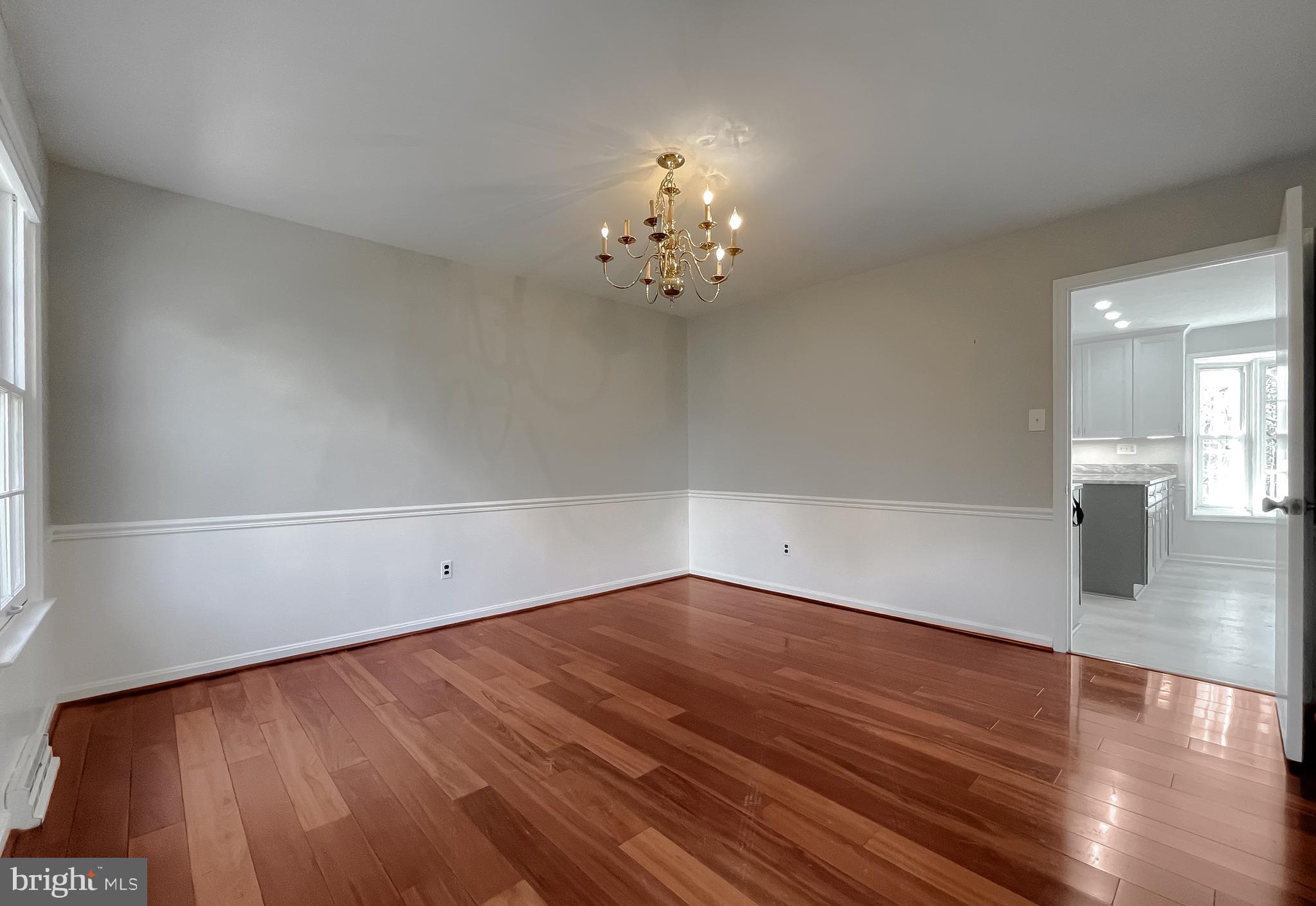 513 Clarks Run Road La Plata, MD 20646 - Photo 7 of 45 wooden floor in an empty room with a window