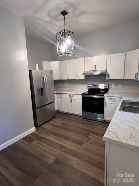306 White Store Road Wadesboro, NC 28170 - Photo 16 of 24 a kitchen with stainless steel appliances granite countertop a sink a stove a microwave and cabinets