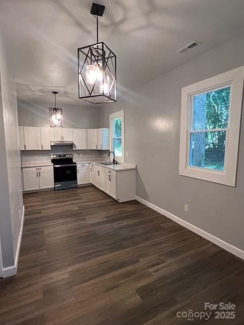 306 White Store Road Wadesboro, NC 28170 - Photo 17 of 24 a kitchen with stainless steel appliances granite countertop a stove and wooden floor