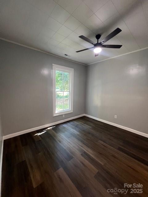 306 White Store Road Wadesboro, NC 28170 - Photo 9 of 24 an empty room with wooden floor ceiling fan and windows
