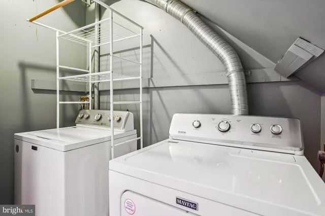 a bathroom with a shower and toilet