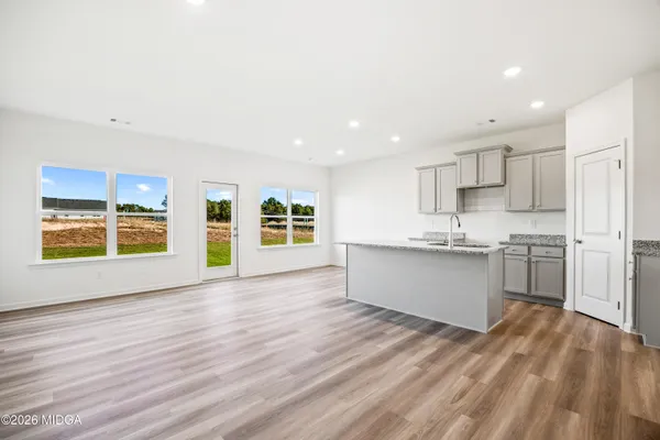 a view of kitchen with wooden floor