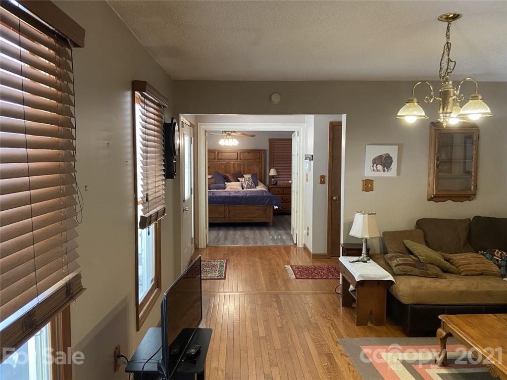 433 Foster Lake Road Blacksburg, SC 29702 - Photo 13 of 40 a living room with furniture and a chandelier