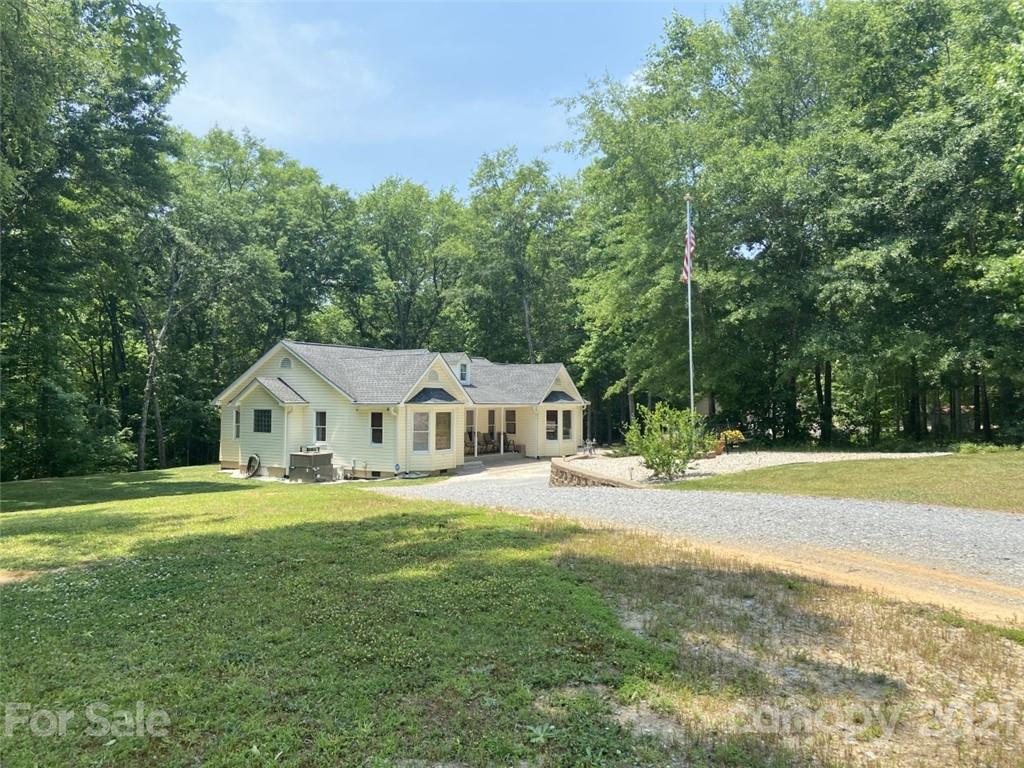 433 Foster Lake Road Blacksburg, SC 29702 - Photo 3 of 40 a view of a house with a big yard and large trees