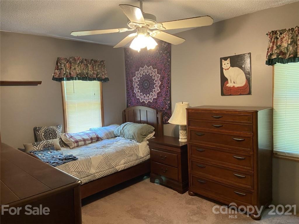 433 Foster Lake Road Blacksburg, SC 29702 - Photo 21 of 40 a bedroom with a bed and a dresser