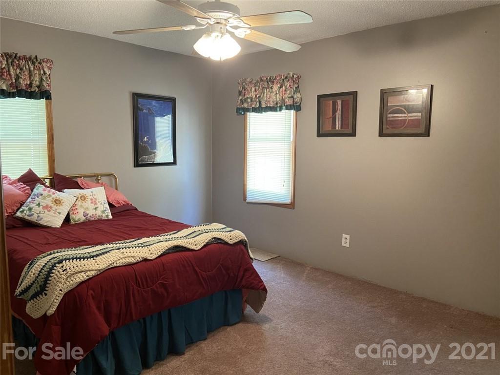 433 Foster Lake Road Blacksburg, SC 29702 - Photo 22 of 40 a bedroom with a bed and a window