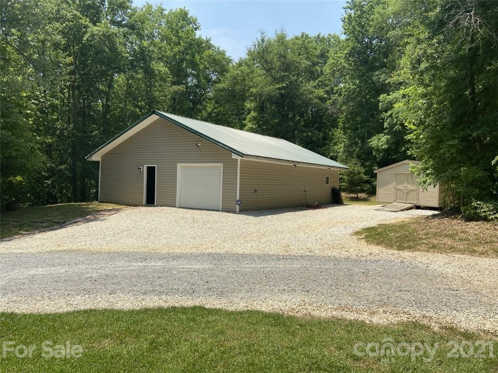 433 Foster Lake Road Blacksburg, SC 29702 - Photo 26 of 40 a house with a yard and large trees