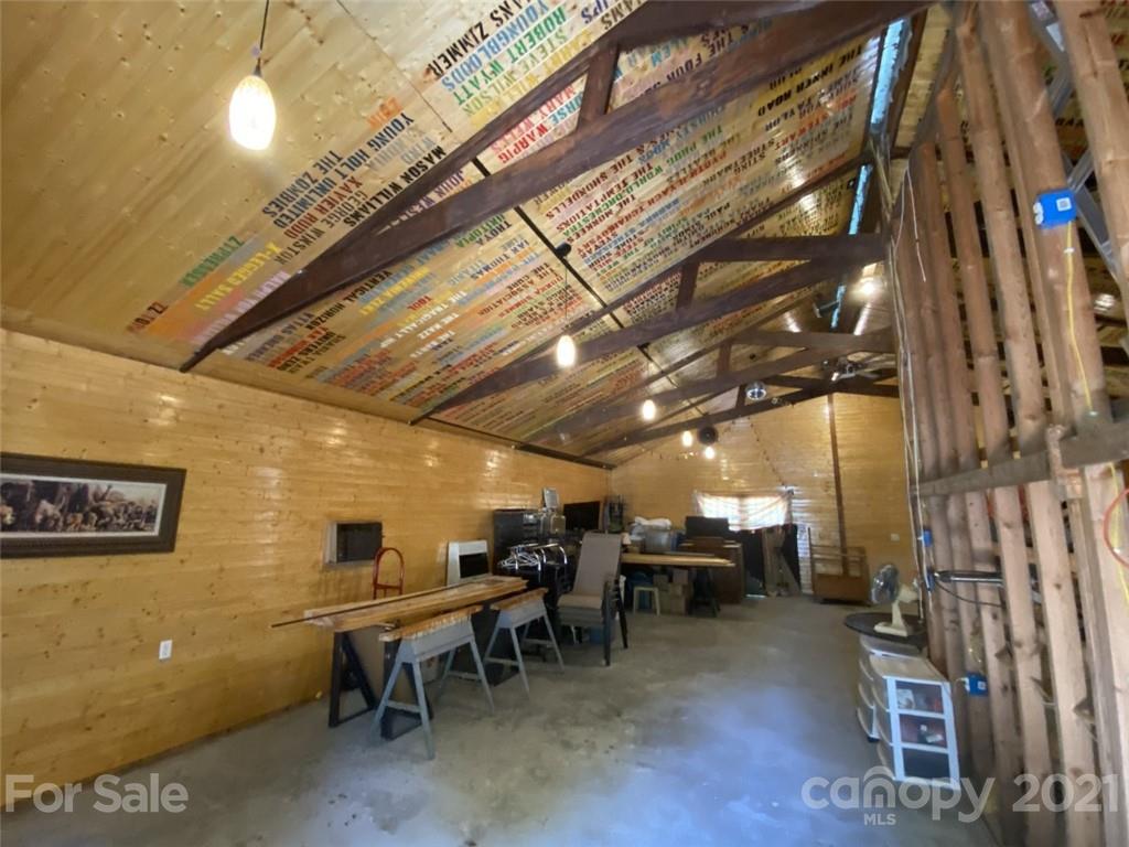 433 Foster Lake Road Blacksburg, SC 29702 - Photo 28 of 40 a room with lots of furniture and a chandelier