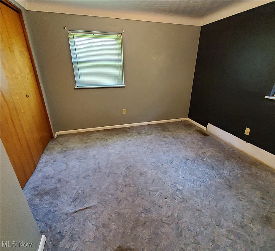 13075 Conquer Hill Road Byesville, OH 43723 - Photo 18 of 36 Unfurnished bedroom with carpet floors and baseboards