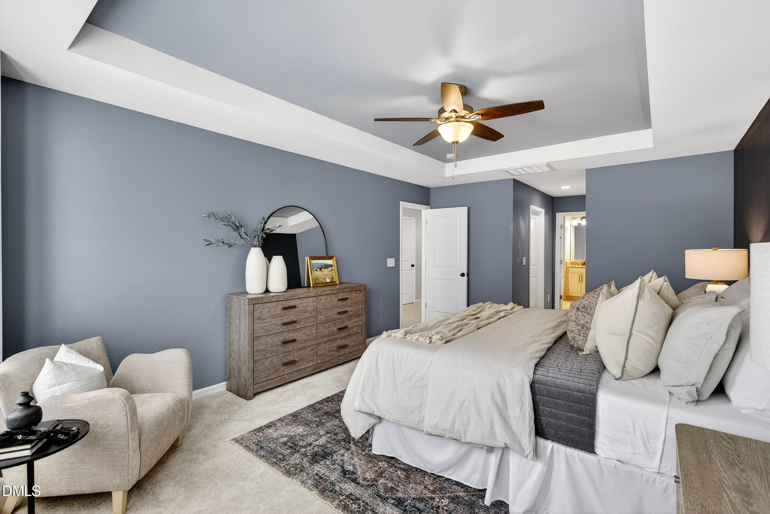 109 Willow View Lane Apex, NC 27539 - Photo 24 of 72 a bedroom with a bed and ceiling fan