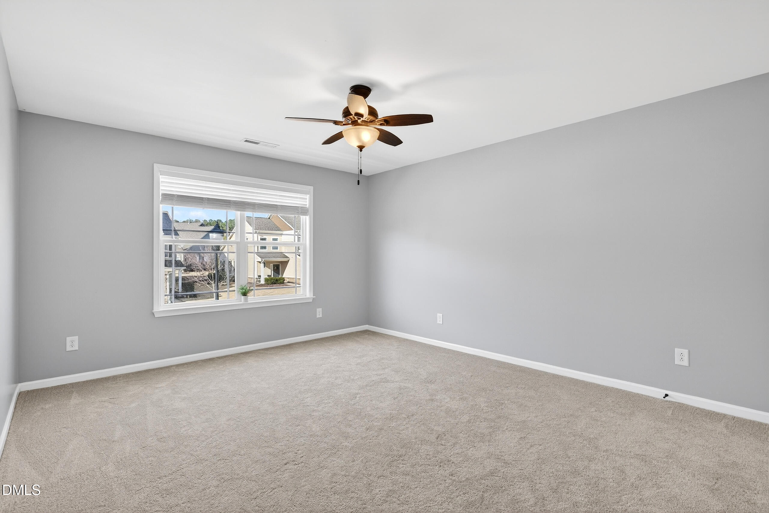 109 Willow View Lane Apex, NC 27539 - Photo 35 of 72 an empty room with windows and fan