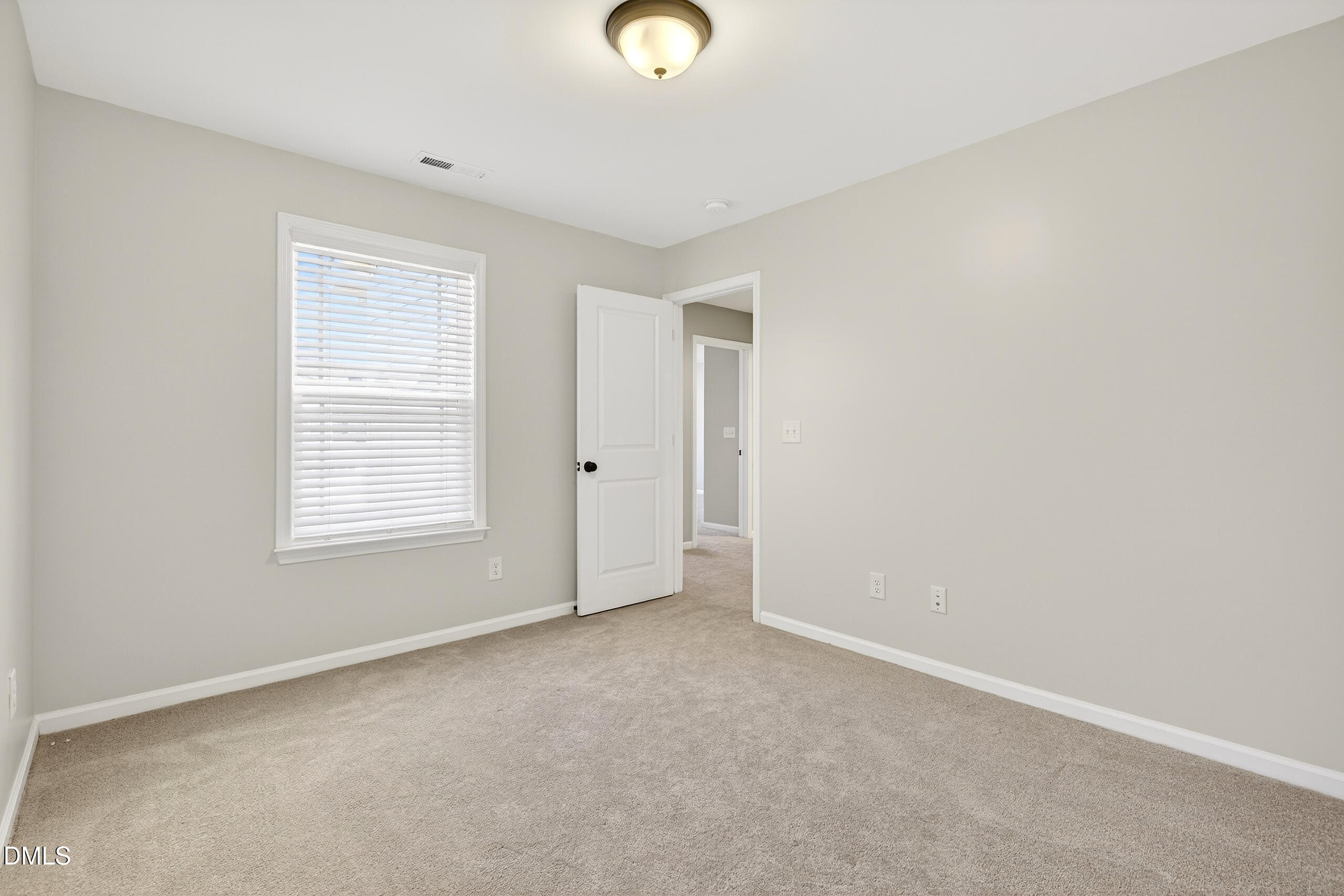109 Willow View Lane Apex, NC 27539 - Photo 37 of 72 an empty room with closet and windows