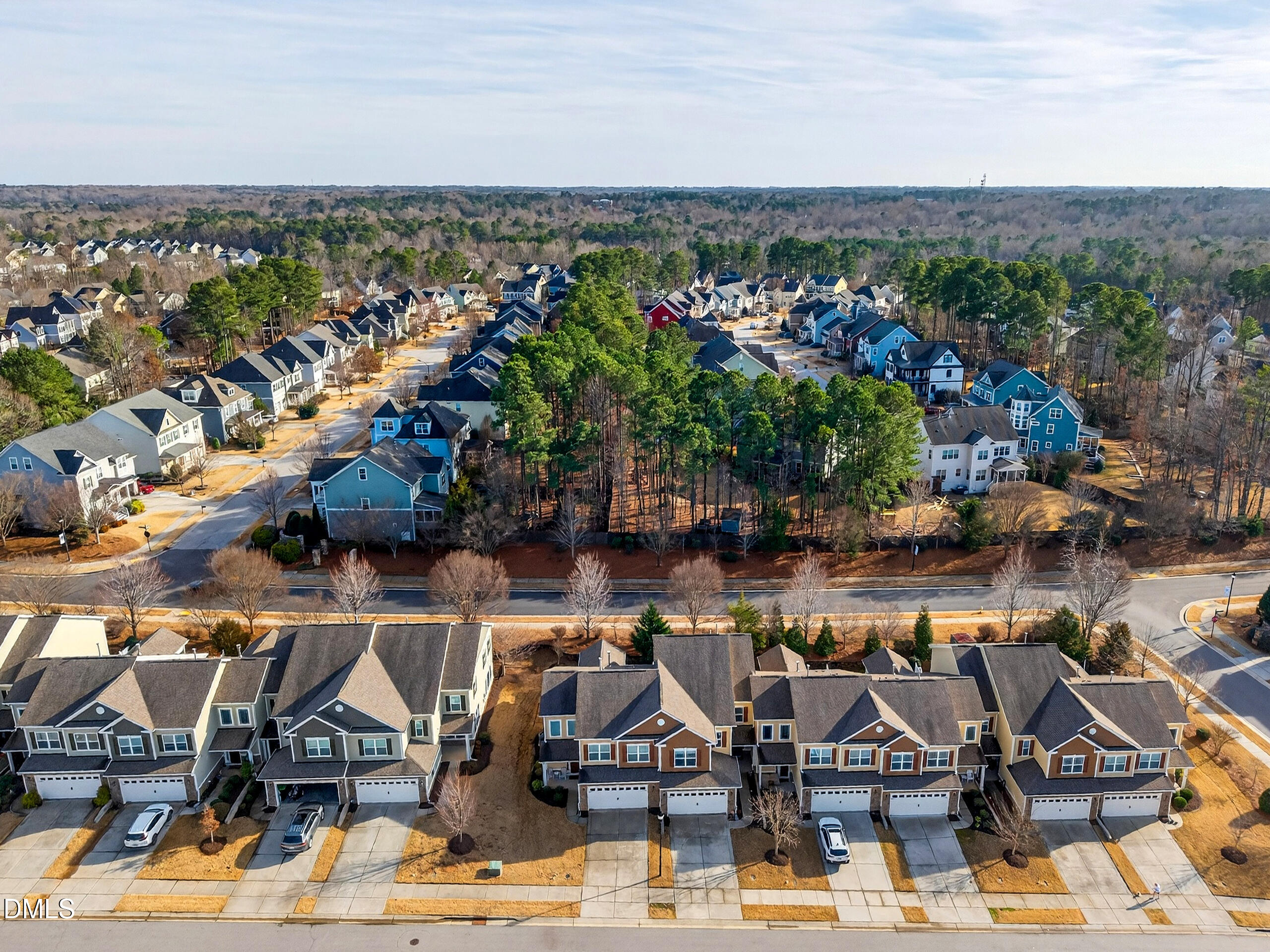 109 Willow View Lane Apex, NC 27539 - Photo 69 of 72 a view of a lake with a table and chairs