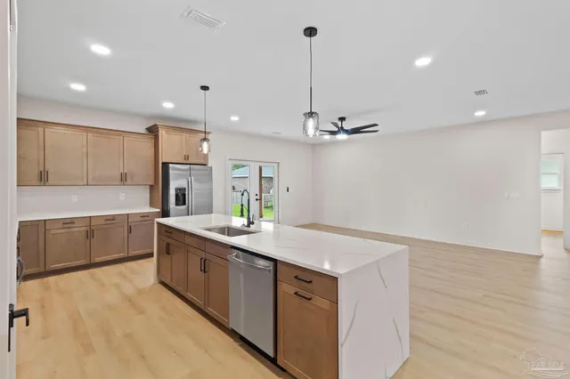 a kitchen with sink cabinets and microwave