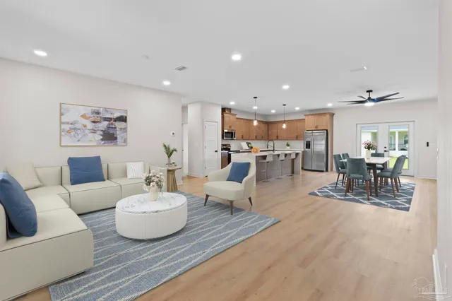 a bedroom with bed and a large window