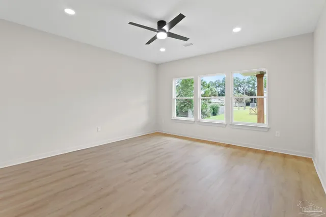 a bathroom with a sink double vanity granite tub shower and a mirror
