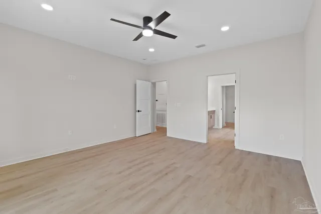 a white bath tub sitting next to a white toilet