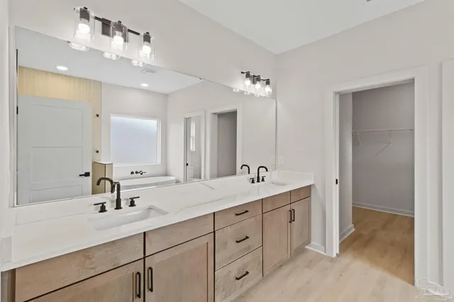 a bathroom with a bathtub and shower