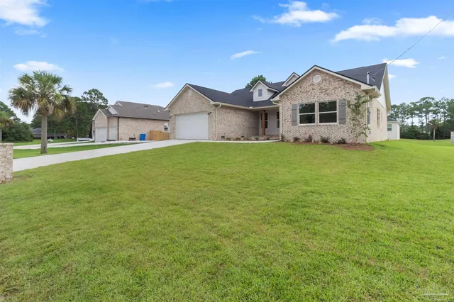 front view of a house with a yard