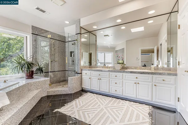 a kitchen with granite countertop a sink and a counter top space