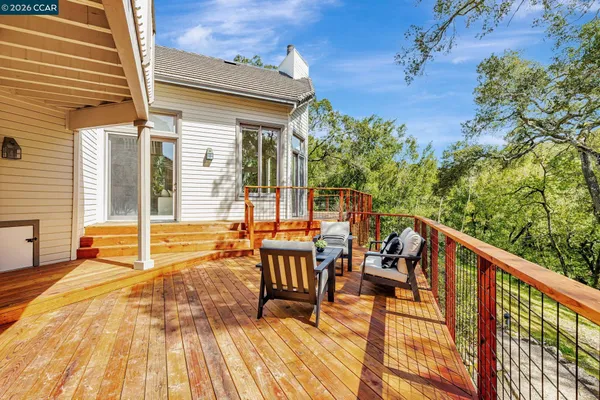 a view of a patio with a table and chairs