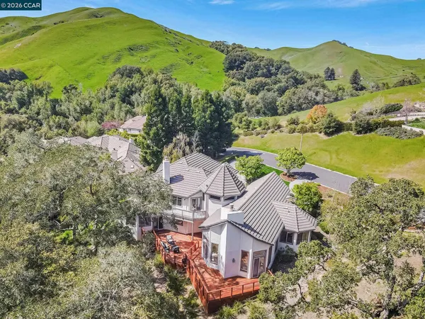 an aerial view of a house with outdoor space