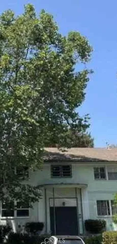 a view of house with a yard