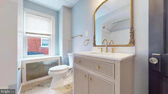 a bath room with a toilet a bath tub and a shower