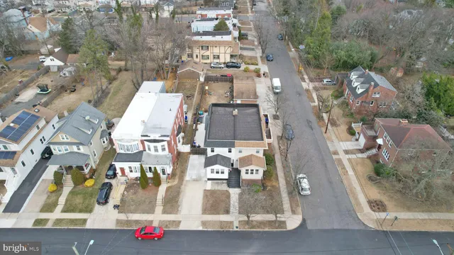 an aerial view of residential houses with outdoor space