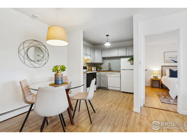a view of kitchen and dining area with chandelier