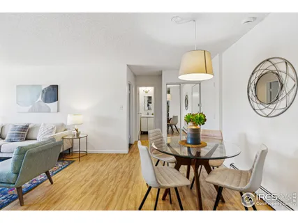 a dining room with furniture and a chandelier