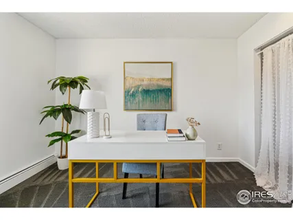 a view of kitchen island with furniture and wooden floor