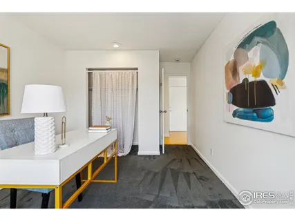 a hallway with a table and a mirror