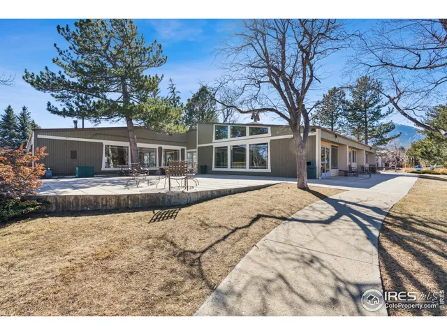 a dining room with furniture a table and chairs