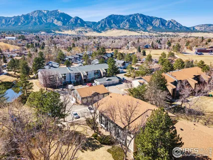 an aerial view of a house with a ocean view