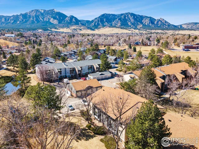 an aerial view of a house with a ocean view