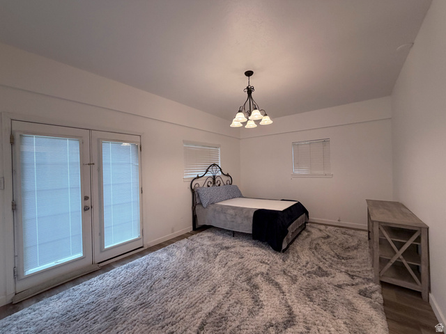 2855 South 1000 West Perry, UT 84302 - Photo 141 of 142 Bedroom with access to outside, a chandelier, and french doors