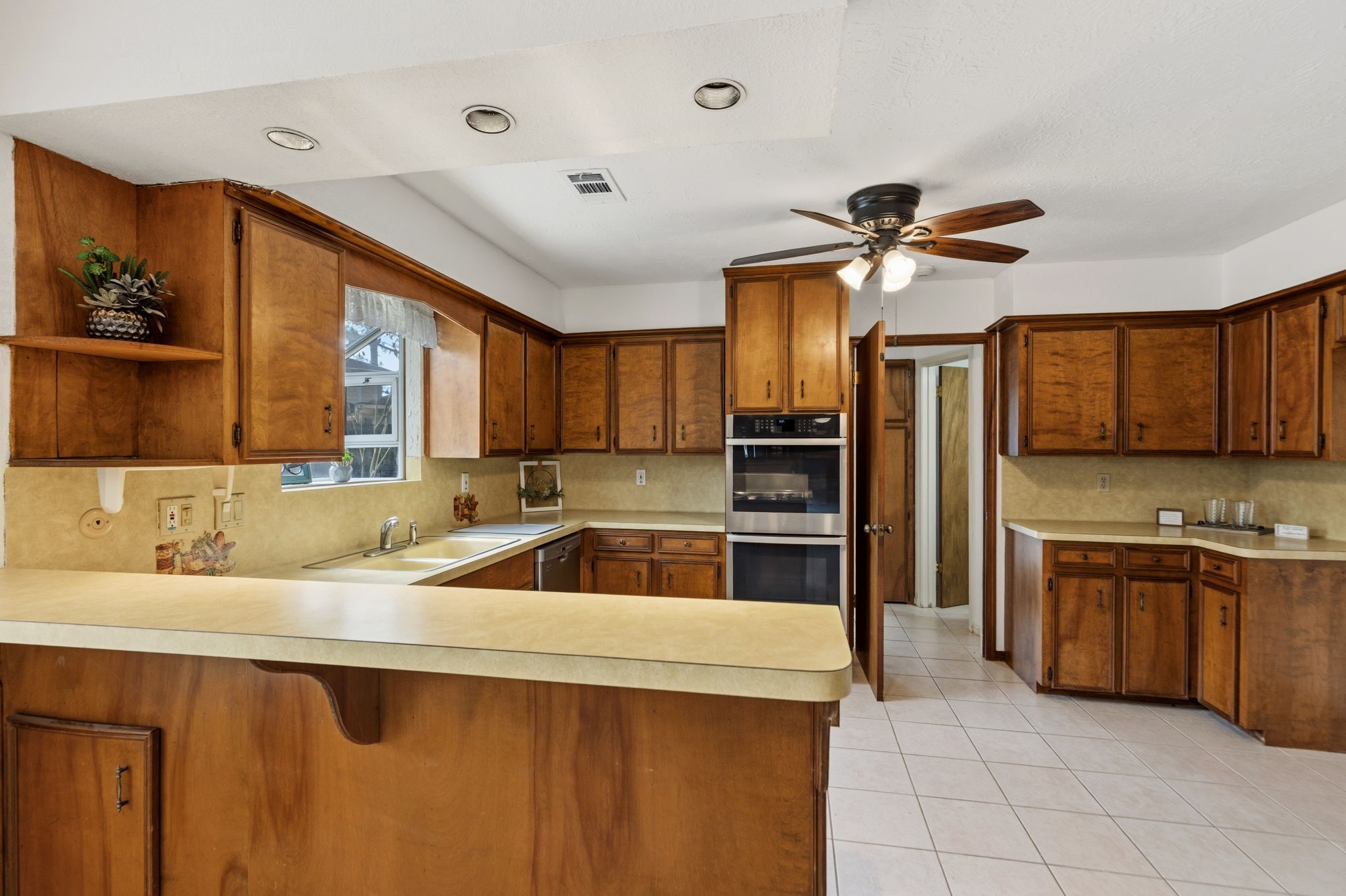 17507 Oxhill Court Spring, TX 77388 - Photo 13 of 44 Plenty of cabinets in the kitchen, and a double oven! What a great idea to put a ceiling fan in the kitchen!