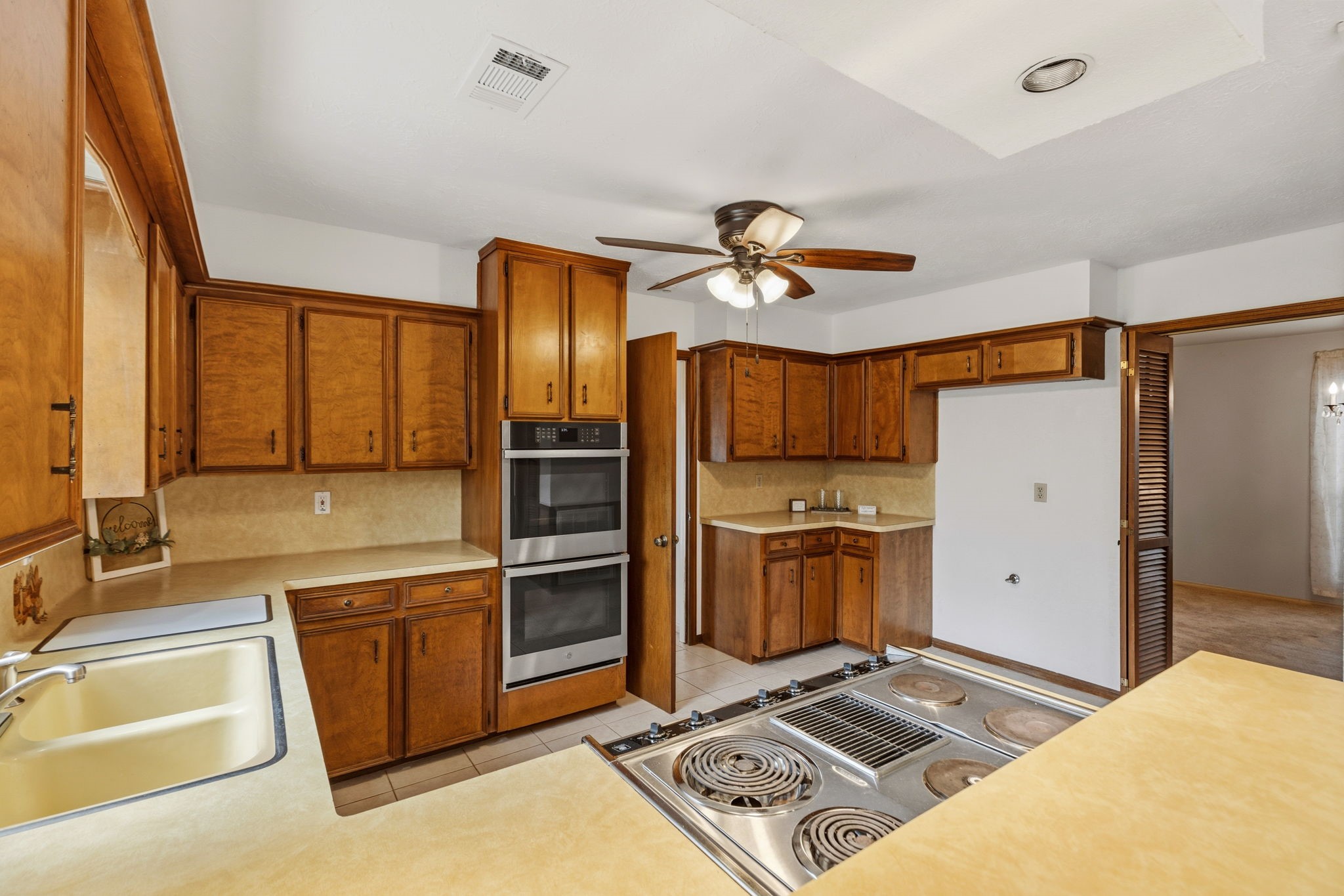 17507 Oxhill Court Spring, TX 77388 - Photo 14 of 44 This electric cooktop has interchangeable burners that can convert to a griddle or a grill. These extra burners are located in the smaller pantry. Also notice all the counterspace!